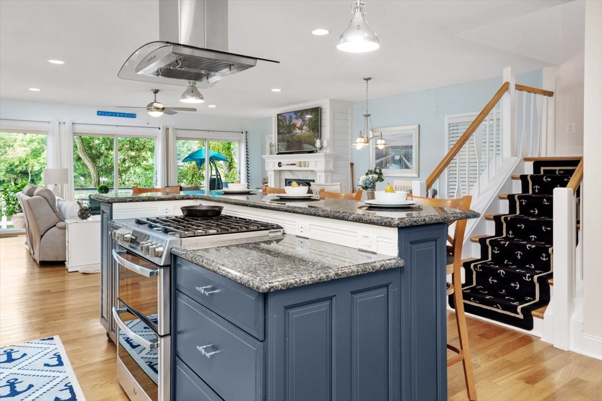 nautical kitchen with blue cabinet island by parker design build