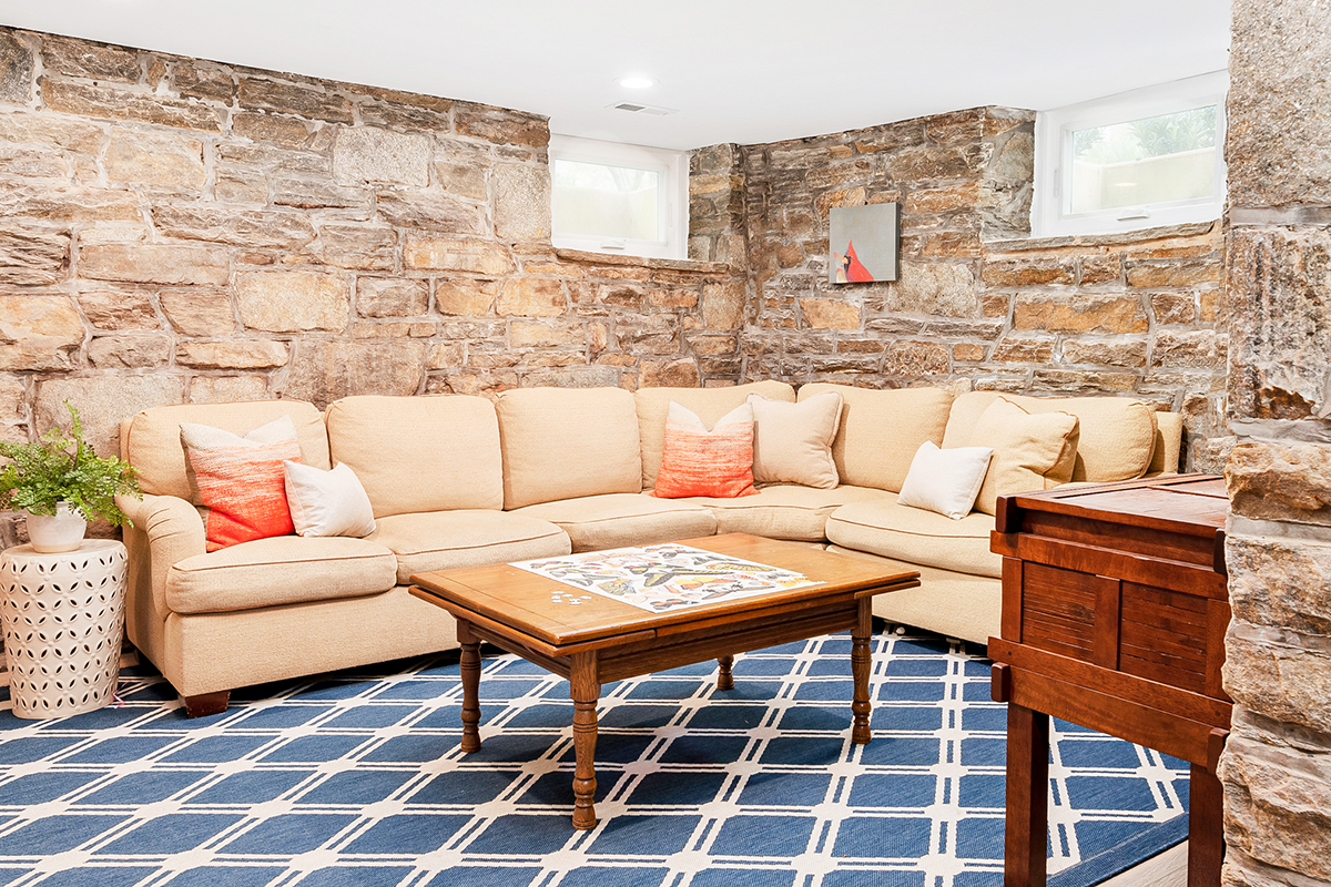 finished basement with stone walls