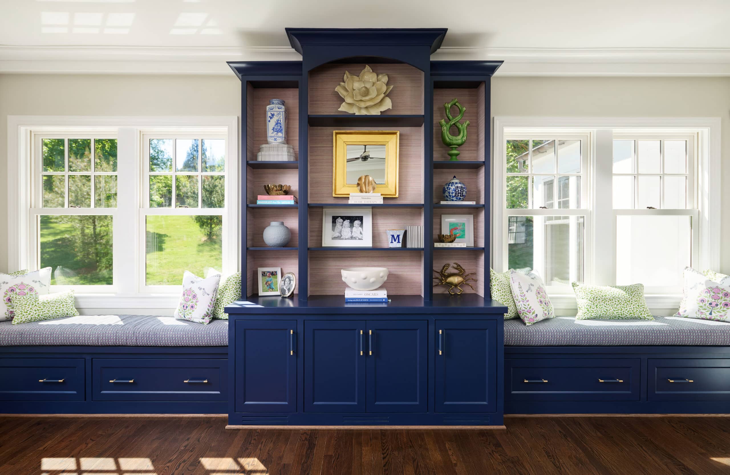 custom built in navy blue window seat and bookcase with fabric background ruxton md